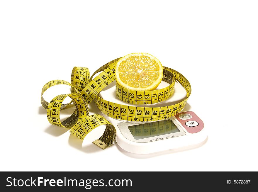 Lemon And Tape Measure On The Scale