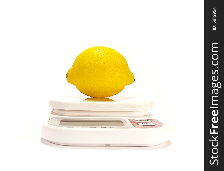 Yellow Lemon and scale isolared on white background. Yellow Lemon and scale isolared on white background