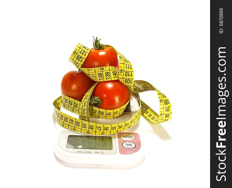 Ripe juicy tomatos and tape measure isolated