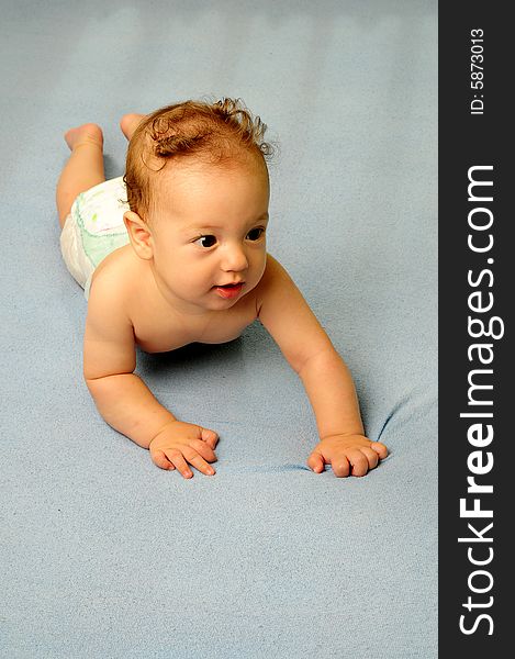 Baby boy isolated over blue