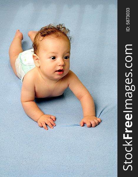 Baby boy isolated over blue