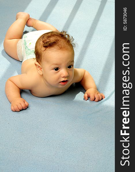 Baby boy isolated over blue