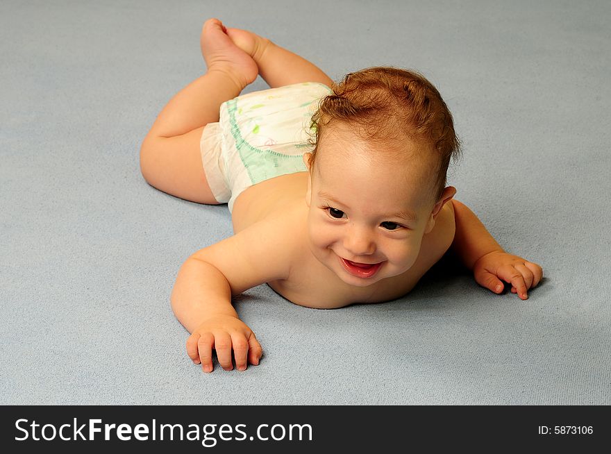 Baby boy isolated over blue