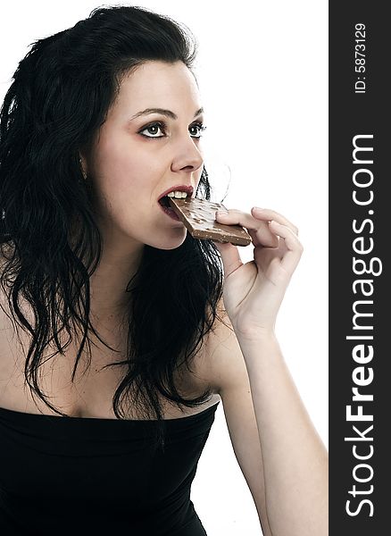Girl eating a slab of chocolate. Girl eating a slab of chocolate