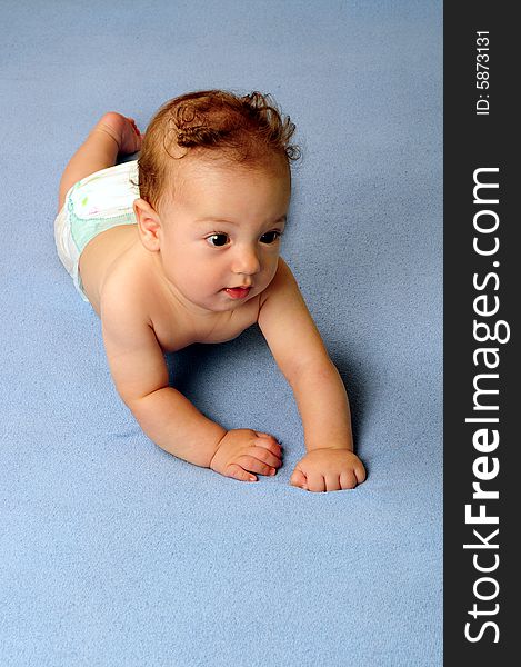 Baby boy isolated over blue