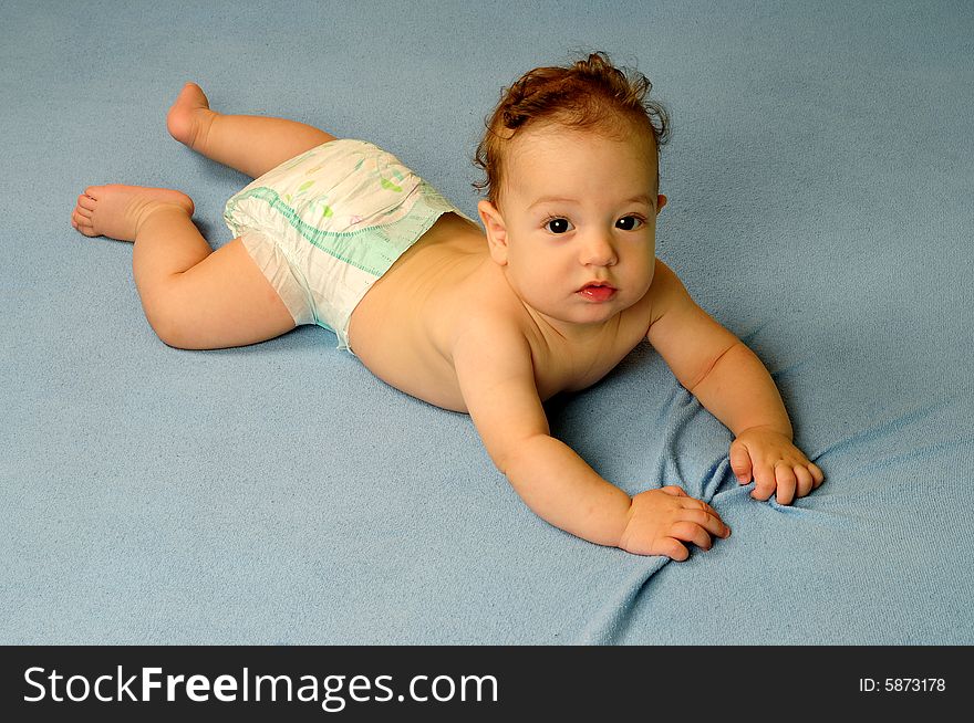 Baby boy isolated over blue