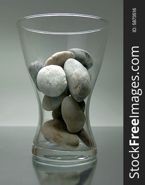 River rocks in a vase isolated