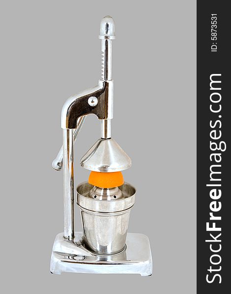 Hand juicer with orange on grey background