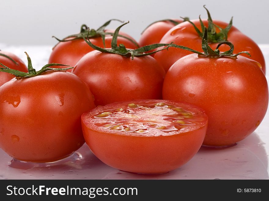 Fresh and nice tomatoes with water droplets.