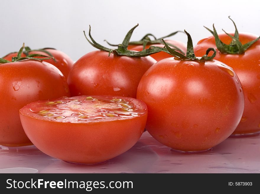 Fresh and nice tomatoes with water droplets.