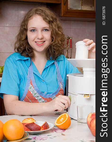 Girl with blender and fruits on home kitchen