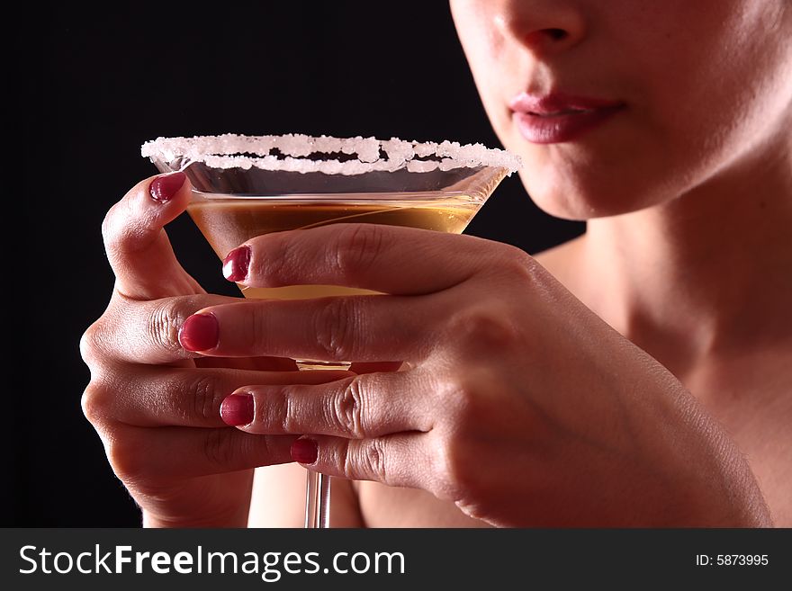 Beautiful young woman holding a martini glass. Beautiful young woman holding a martini glass