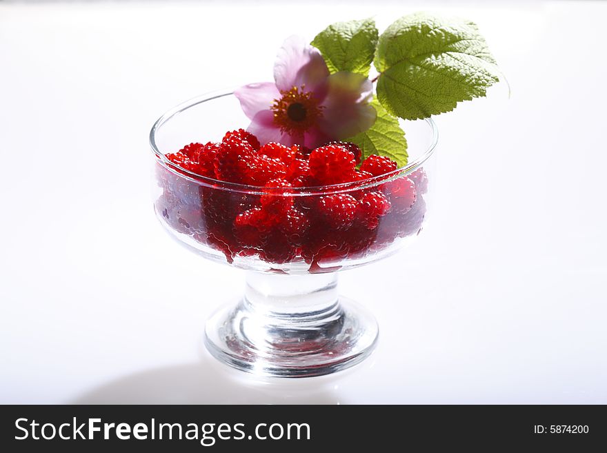 Raspberries In A Glass