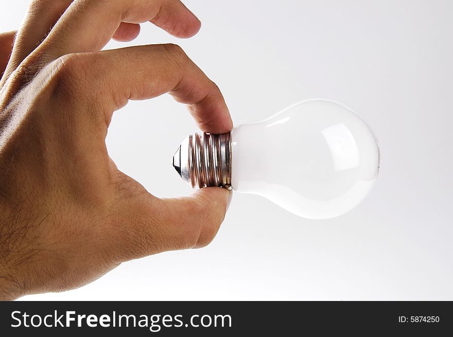 Photo of hand and light bulb