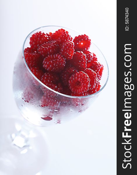 Raspberries In A Glass