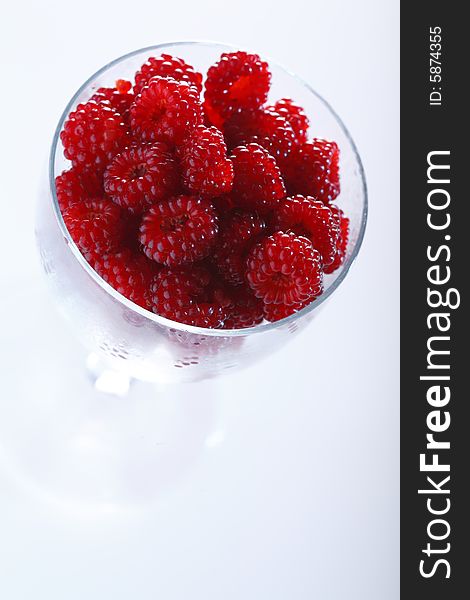 Raspberries In A Glass