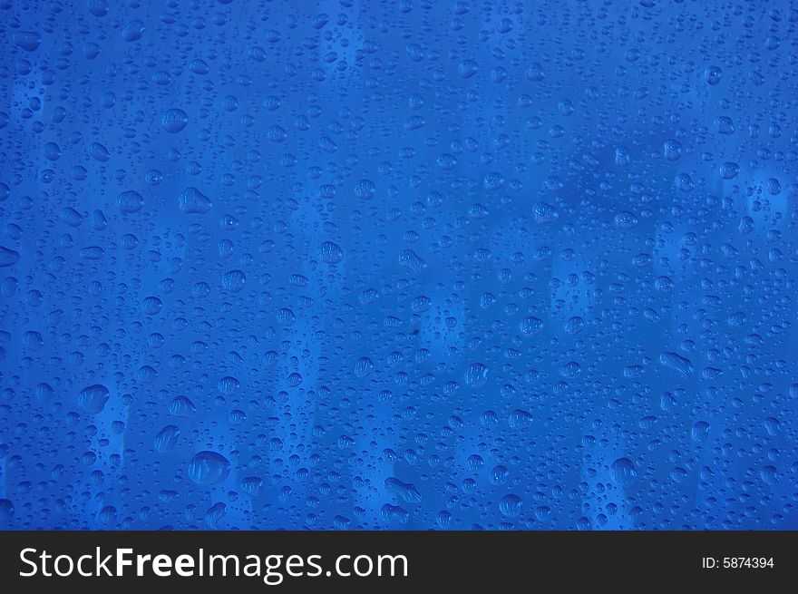 Abstract figure with water drops on glass