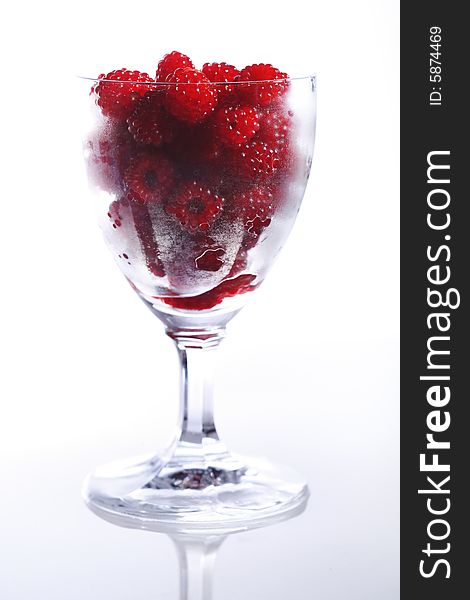 Raspberries In A Glass