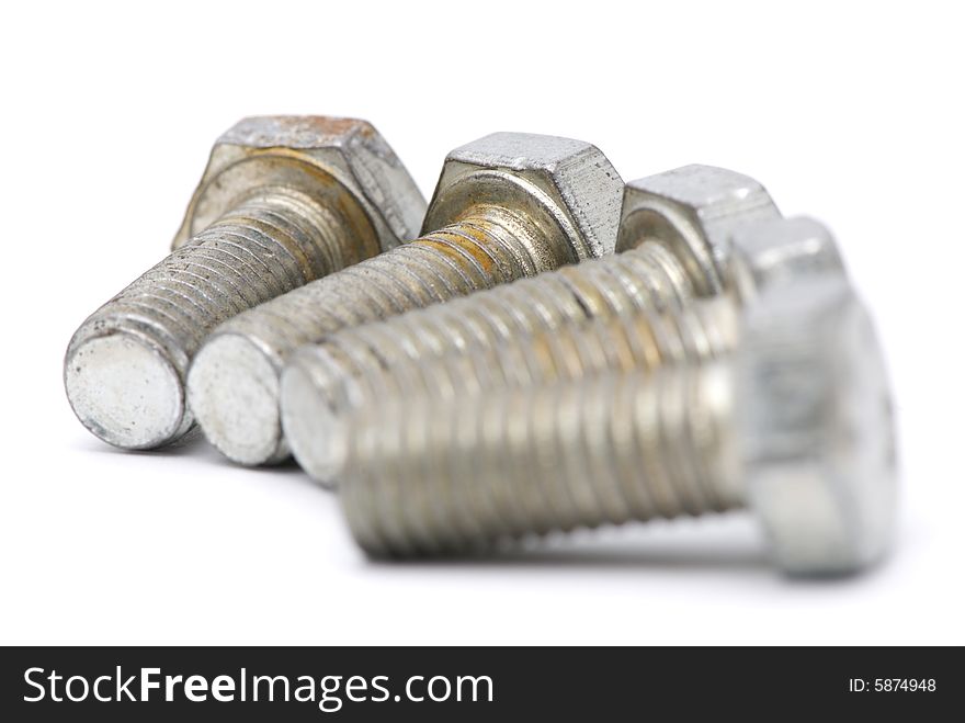 Metal bolts on white background