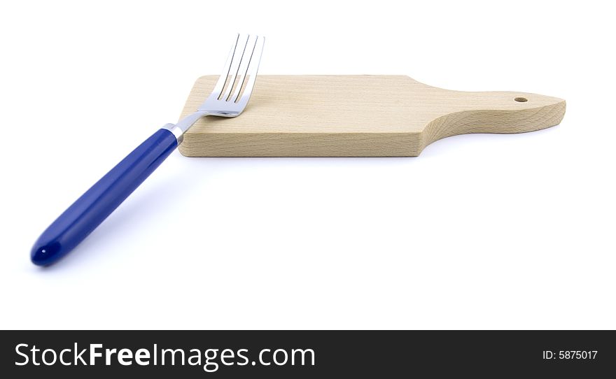 Metal Fork And Wooden Board