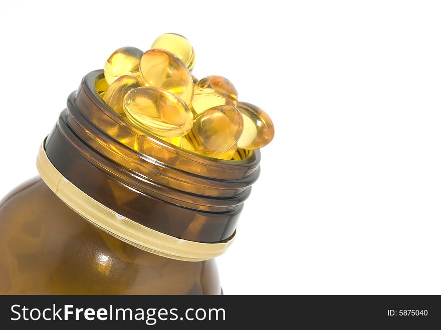 Closeup of bottle full of pills on white background. Closeup of bottle full of pills on white background