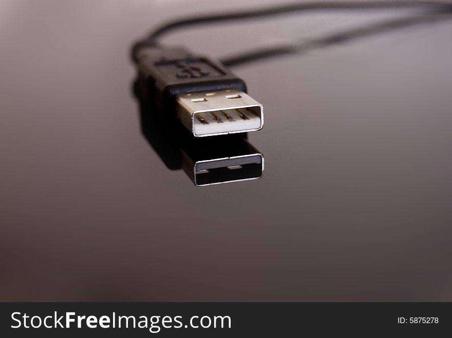 USB port with reflection on a grey background