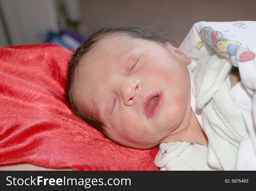 Little newborn caucasian girl lying in mothers hands. Little newborn caucasian girl lying in mothers hands