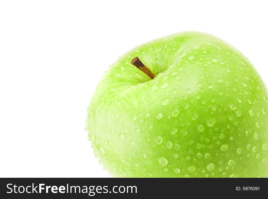 Detail of healthy green apple with fresh water drops isolated on white background. Detail of healthy green apple with fresh water drops isolated on white background