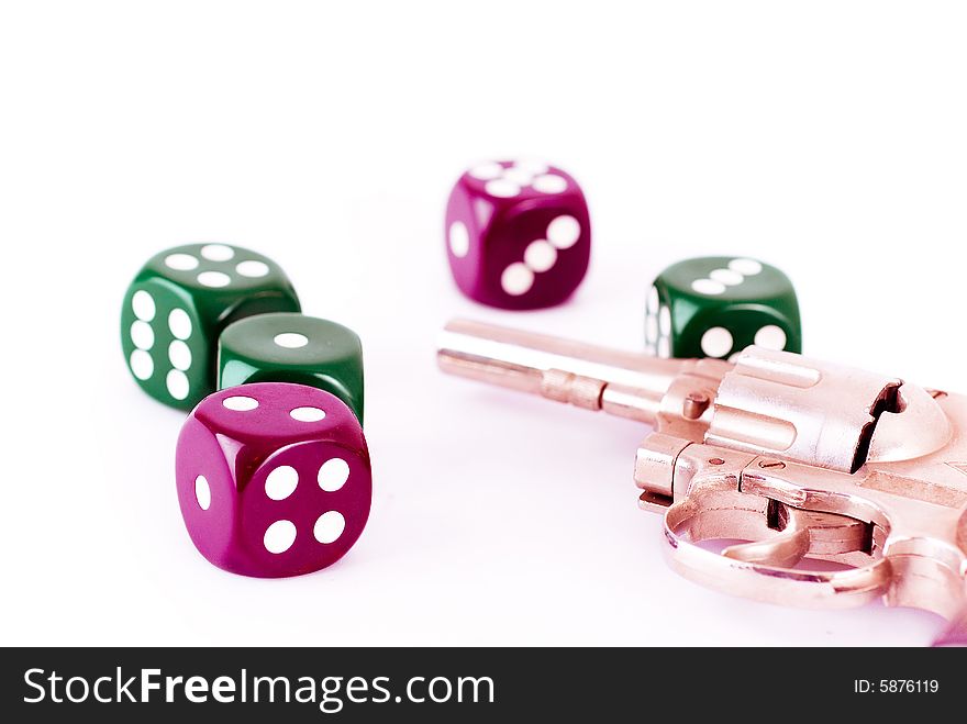 Dice and gun on the white background