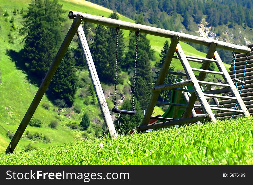 A suggestive shot of a wood's see-saw in a mountain hill