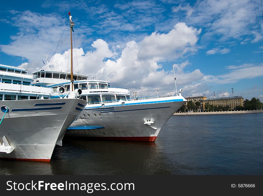 Two ships and sky with clouds