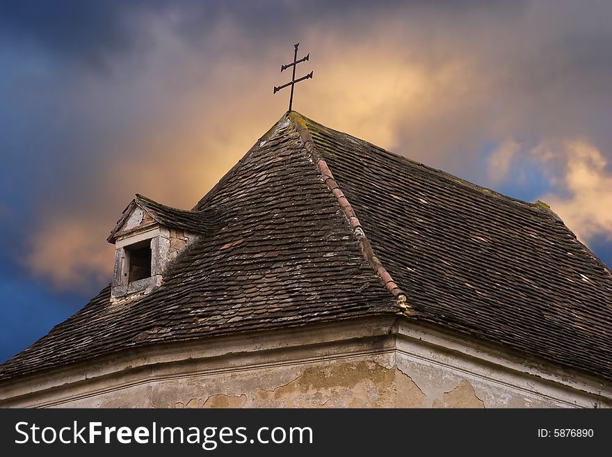 Roof of an old castle against a dramatic sky