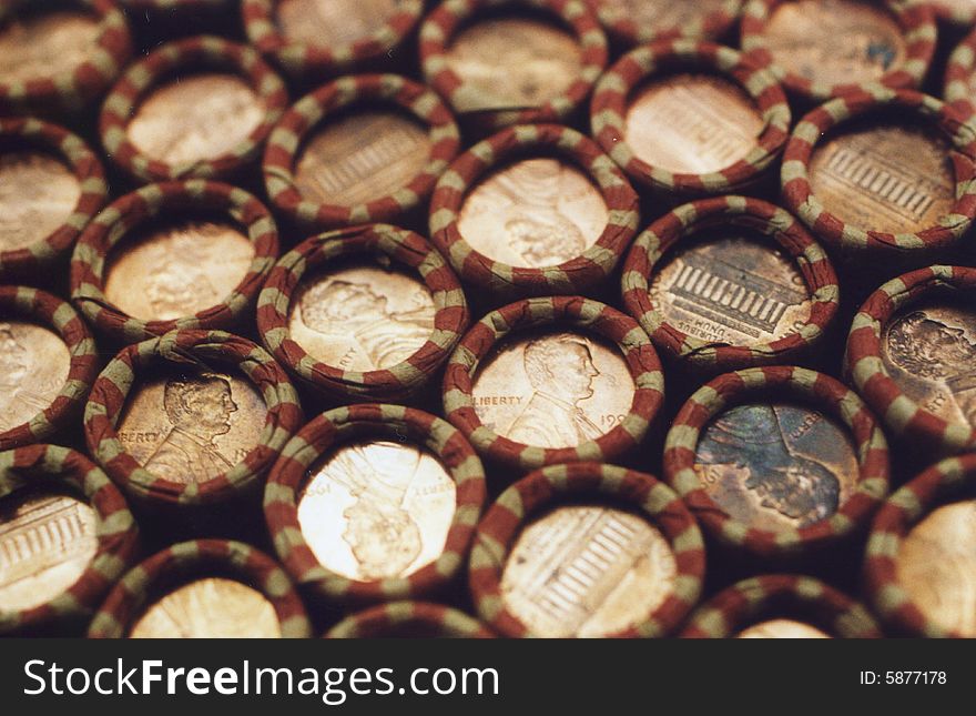 Photo of several rolls of pennies stacked up.