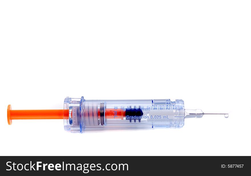 Retractable syringe with droplet on white background. Retractable syringe with droplet on white background