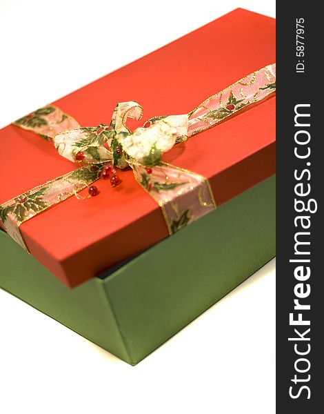 Red and green gift box with beautiful ribbon close up