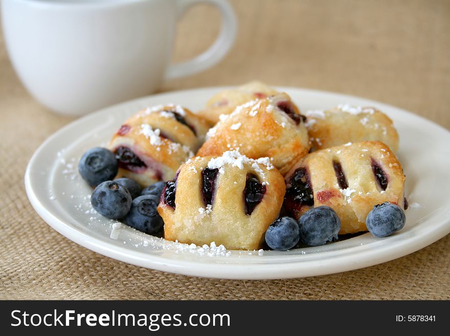 Blueberry mini bites with powder sugar and fresh blueberries. Blueberry mini bites with powder sugar and fresh blueberries.