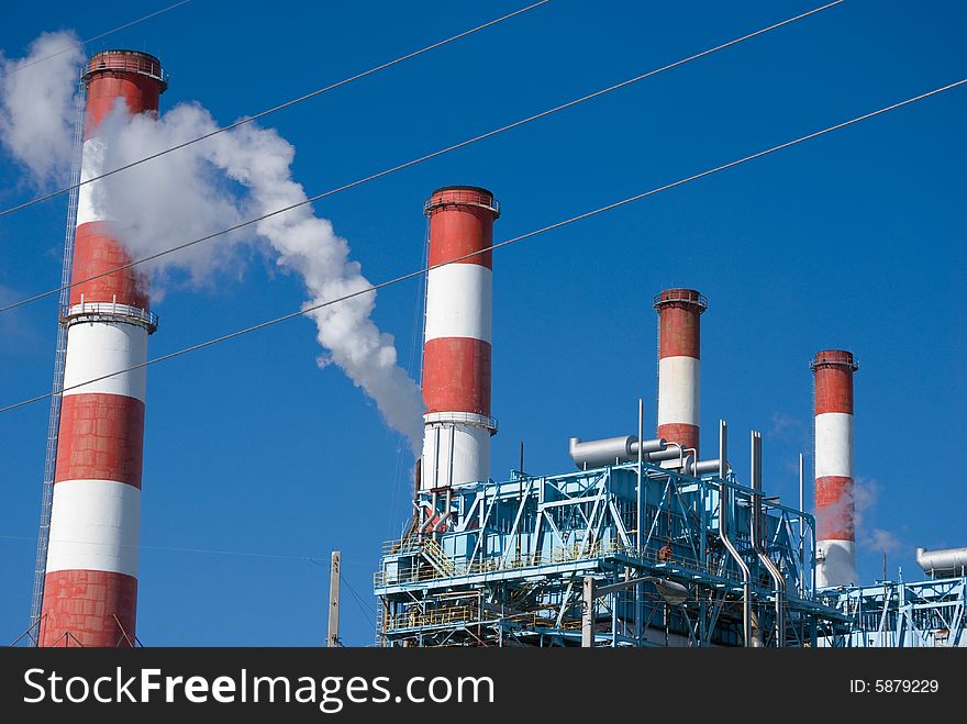 Process plants smoke stacks with smoke spewing