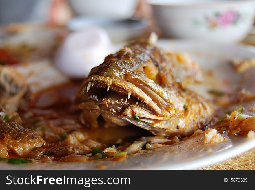 A lunch of whole fried fish on a junk boat in ha long bay, vietnam. A lunch of whole fried fish on a junk boat in ha long bay, vietnam