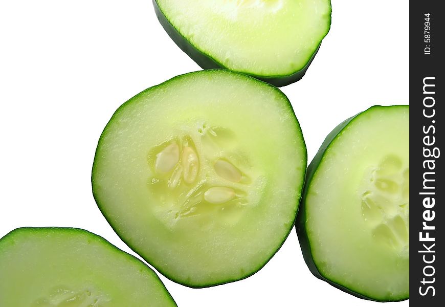 Slices of cucumber on a white background. Slices of cucumber on a white background.