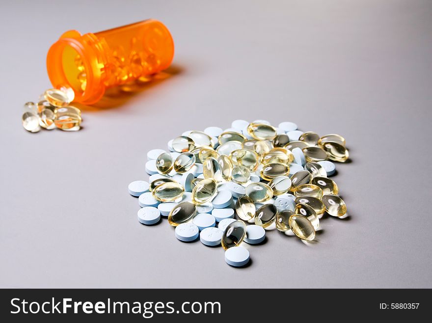 Medicine in capsules and tablets in a bottle