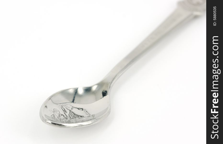 A silver spoon on white background.
