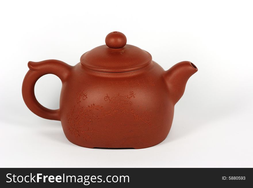 Close up to Chinese tea pot on white.