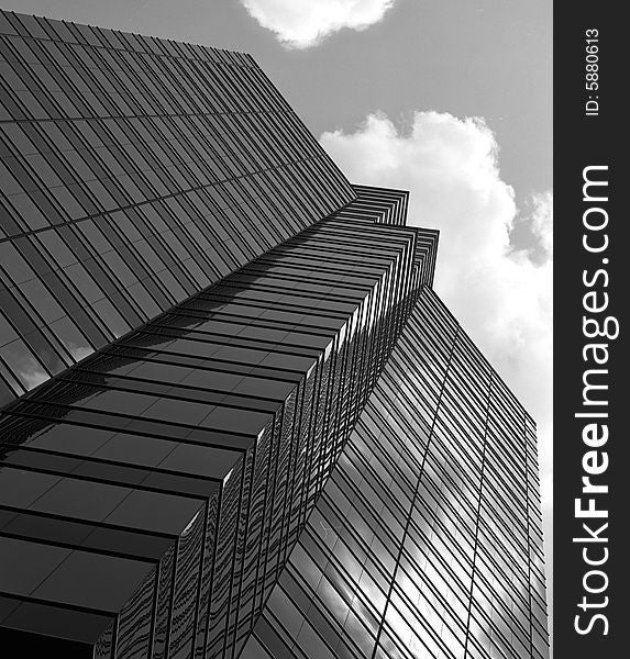 Black and White glass building and clouds