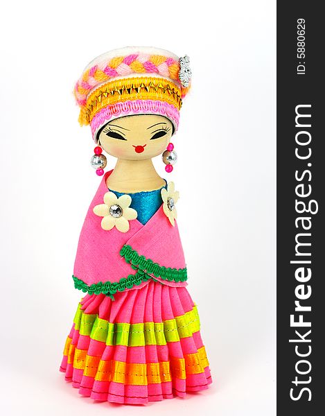 Chinese doll with ethnologic clothes and headgear on white background. Chinese doll with ethnologic clothes and headgear on white background.