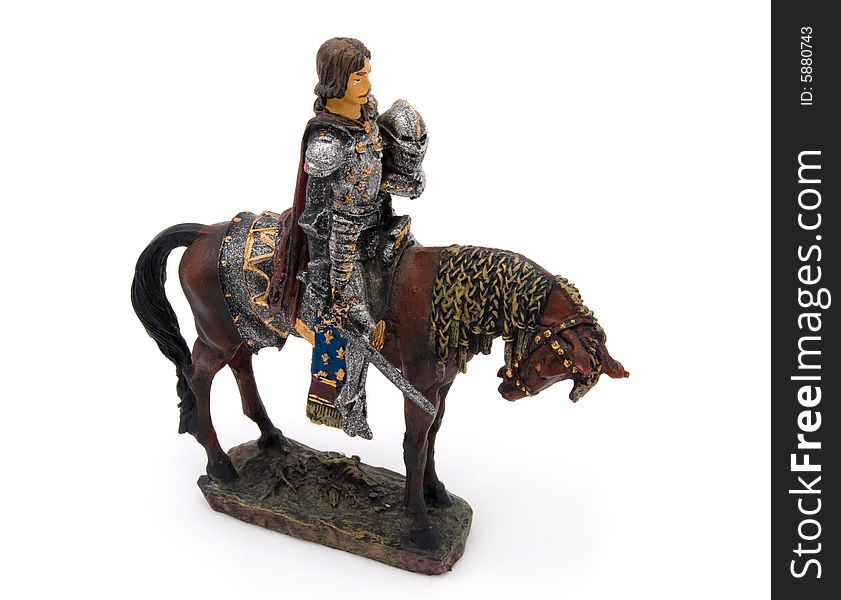 Small toy isolated knight horseman with sword. Small toy isolated knight horseman with sword