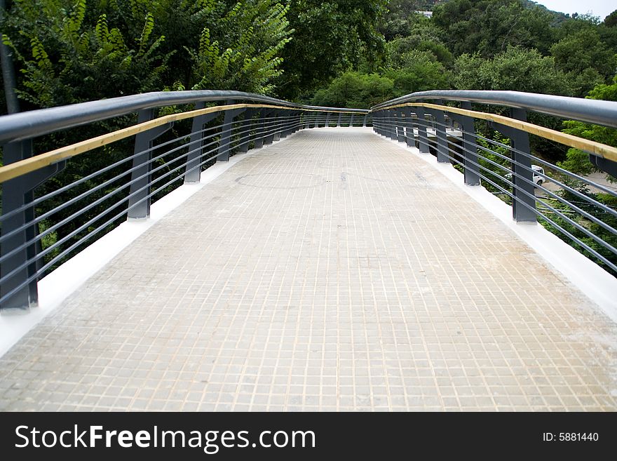 Entrance of a bridge with background of trees