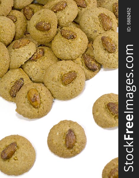 Oatmeal cookies with almond close up on white background