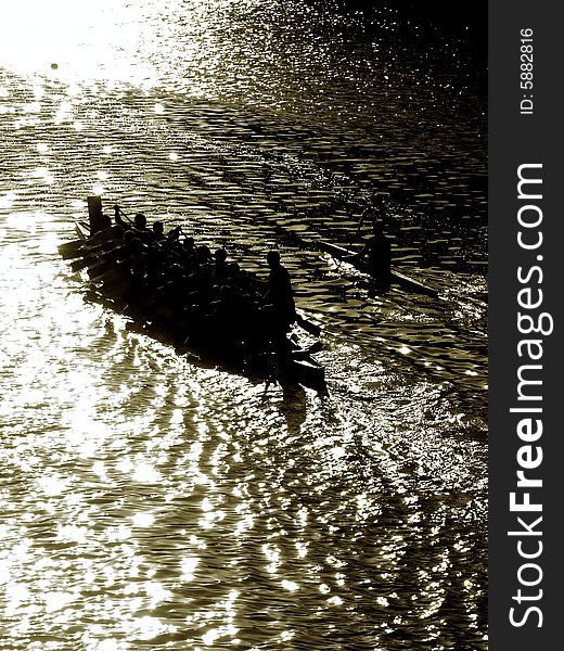 A suggestive shot of canoes on the Arno river at the sunset. A suggestive shot of canoes on the Arno river at the sunset