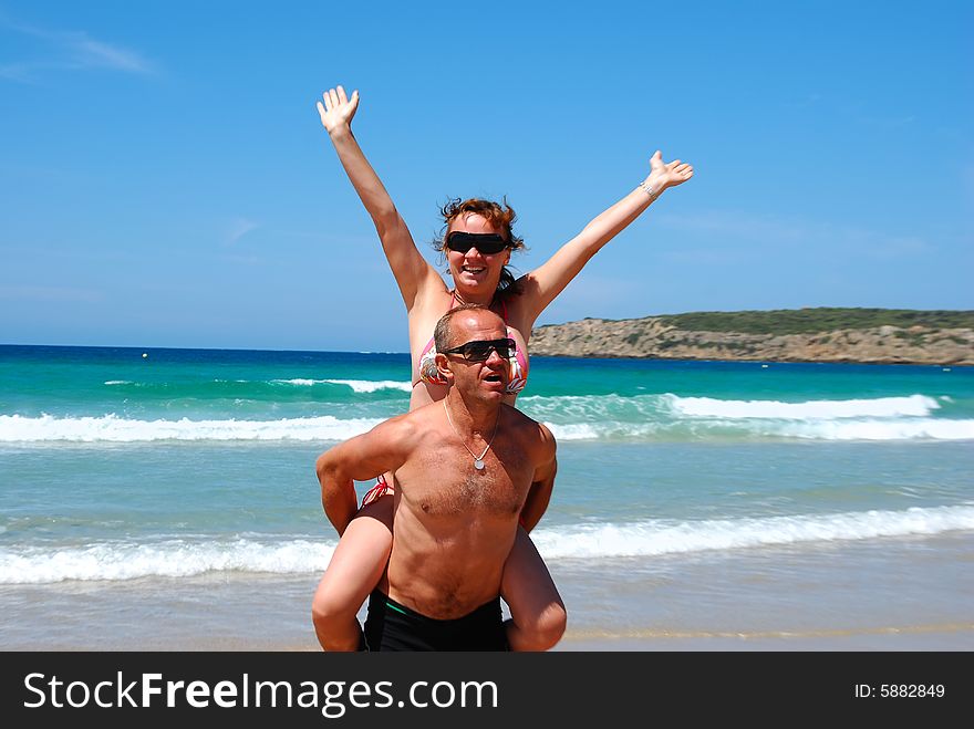 Man and  woman have a rest on coast of ocean