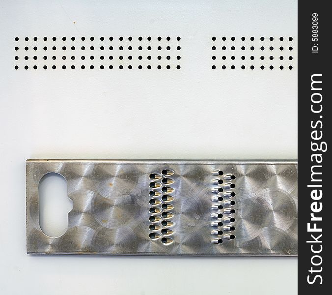Grater on a metallic sheet, can be used in a design and for creation and processing of different images